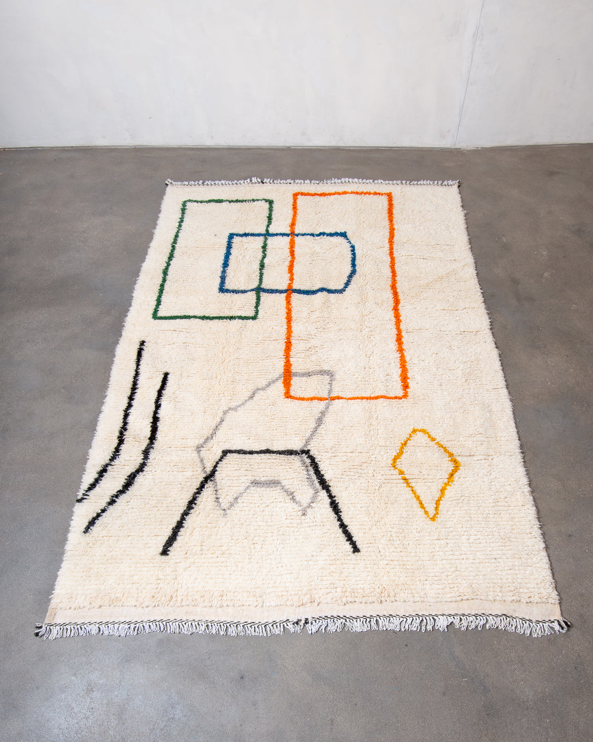 Modern, designer, handcrafted Berber rug from Morocco. Beniourain carpet with beautiful colours and patterns and fluffy wool texture.
